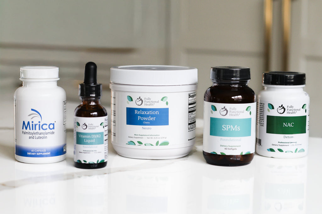 Collection of health and wellness products on a white surface with a neutral background