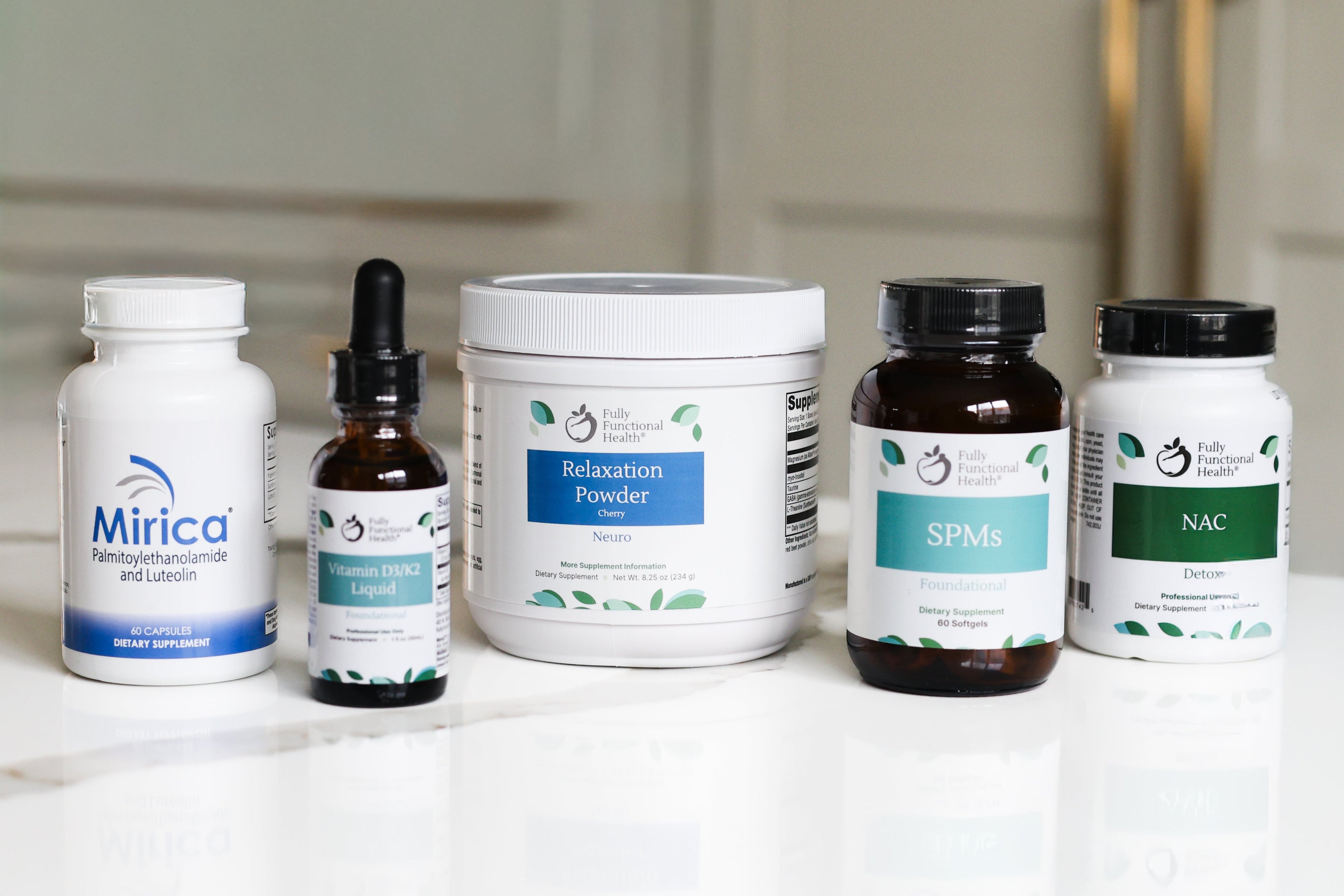 Collection of health and wellness products on a white surface with a neutral background